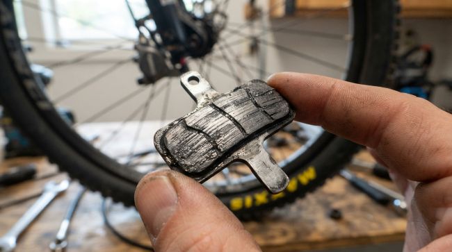 Cleaning bicycle brake pads to stop squeaking