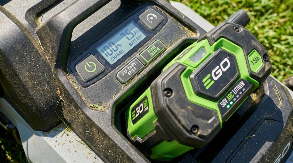 Close-up of an EGO electric mower battery compartment and controls.